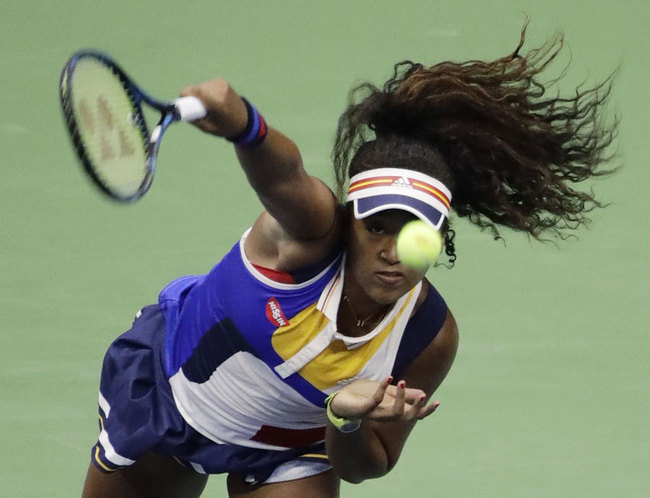 Naomi Osaka, of Japan, serves to Angelique Kerber, of Germany, during the first round of the U.S. Open tennis tournament, Tuesday, Aug. 29, 2017, in New York. [Photo: AP/Frank Franklin II]