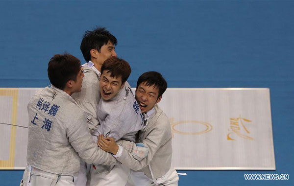 Athletes of Shanghai celebrate after the men's sabre team gold medal match of Fencing against Liaoning at the 13th Chinese National Games in north China's Tianjin Municipality, September 1, 2017. Shanghai claimed the title. [Photo: Xinhua/Cao Can]