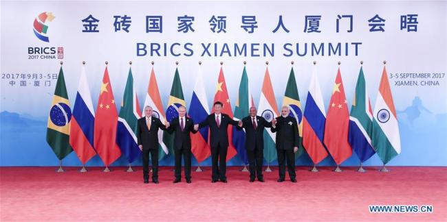 Chinese President Xi Jinping (C) and other leaders of BRICS countries pose for a group photo before the 2017 BRICS Summit in Xiamen, southeast China's Fujian Province, Sept. 4, 2017. [Photo: Xinhua]