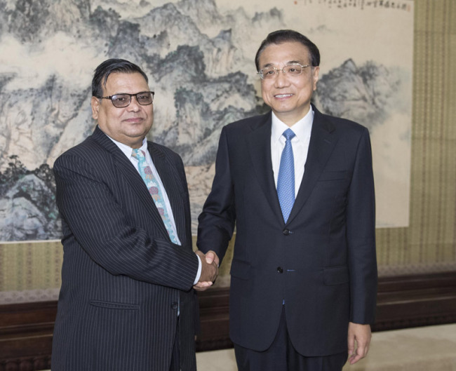Chinese Premier Li Keqiang meets Nepalese Deputy Prime Minister and Foreign Minister Krishna Bahadur Mahara in Beijing on September 7, 2017. [Photo: Xinhua]