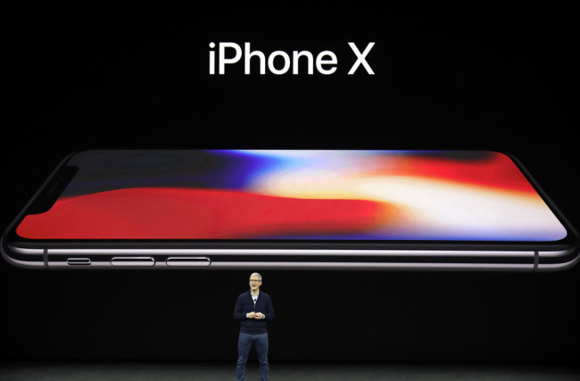 Apple CEO Tim Cook announces the new iPhone X at the Steve Jobs Theater on the new Apple campus, Tuesday, Sept. 12, 2017, in Cupertino, Calif. [Photo: AP/Marcio Jose Sanchez]