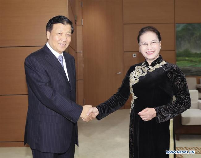 Liu Yunshan (L), a member of the Standing Committee of the Political Bureau of the Communist Party of China Central Committee, meets with Chairperson of the National Assembly of Vietnam Nguyen Thi Kim Ngan in Hanoi, Vietnam, Sept. 19, 2017. [Photo: Xinhua]