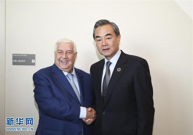 Chinese Foreign Minister Wang Yi meets with Syrian Deputy Prime Minister and Foreign Minister Walid Muallem on Friday, September 22, 2017.[Photo: Xinhua]