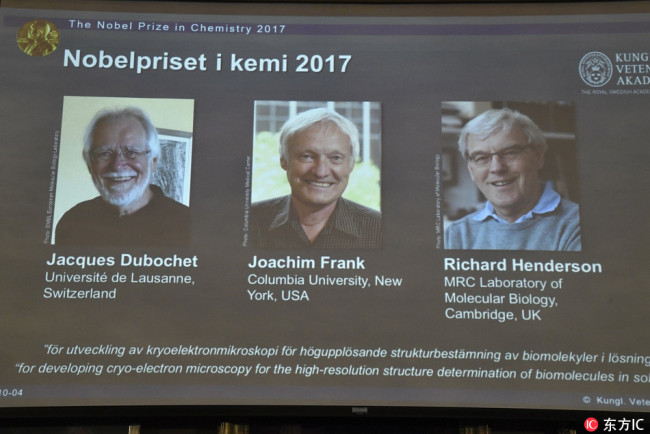 A screen shows (L-R) scientists Jacques Dubochet, Joachim Frank and Richard Henderson who were award the Nobel Prize in Chemistry 2017, during a press conference at the Royal Academy of Sciences in Stockholm, Sweden, 04 October 2017.[Photo: IC]