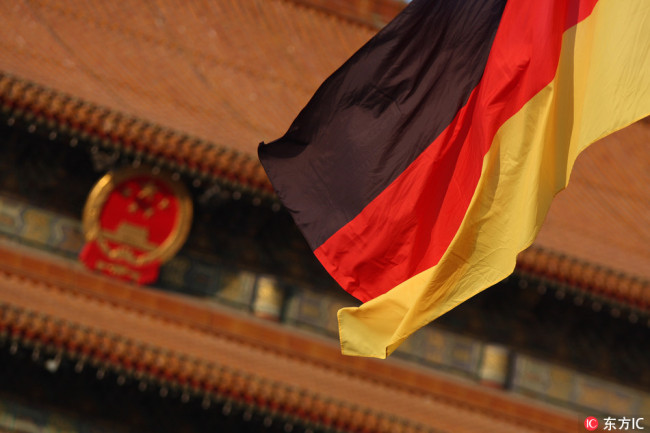 A German national flag flutters on a lamppost on the Tiananmen Square in Beijing, China, 2 February 2012. [Photo: IC]
