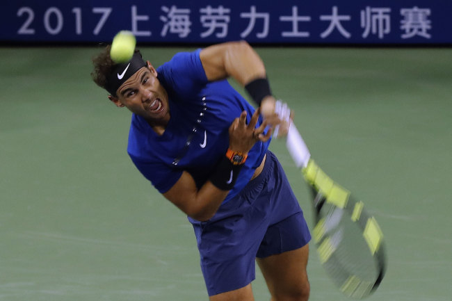 Rafael Nadal of Spain serves against Marin Cilic of Croatia during their men's singles semifinals match in the Shanghai Masters tennis tournament at Qizhong Forest Sports City Tennis Center in Shanghai, China, Saturday, Oct. 14, 2017.[Photo:AP]