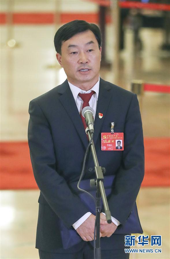 Li Xinmin is a CPC delegate and senior employee with PetroChina's operations in Iraq.[Photo: Xinhua]