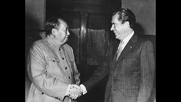 Chairman Mao Zedong shakes hands with U.S. President Richard Nixon in Beijing, Feb. 21, 1972. [Photo: CGTN/Nixon Presidential Library]