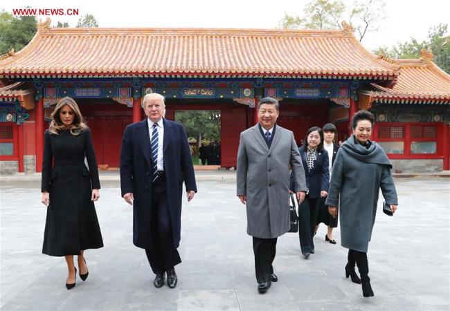 Chinese President Xi Jinping (2nd R) and his wife Peng Liyuan (1st R) welcome U.S. President Donald Trump (2nd L) and his wife Melania Trump at the Palace Museum, or the Forbidden City, in Beijing, capital of China, Nov. 8, 2017. [Photo: Xinhua/Xie Huanchi]
