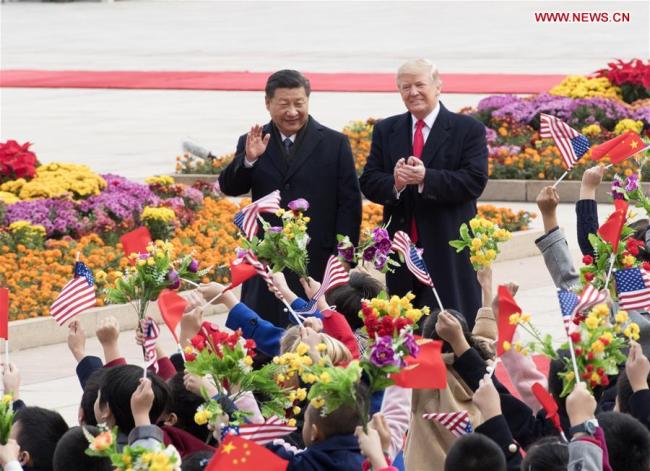 Chinese President Xi Jinping (L) holds a grand ceremony to welcome U.S. President Donald Trump at the square outside the east gate of the Great Hall of the People in Beijing, capital of China, Nov. 9, 2017. [Photo: Xinhua/Li Xueren]