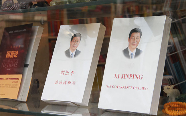 Copies of "Xi Jinping: The Governance of China" [File Photo: China Plus]