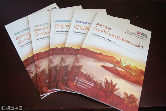 The Lao language version of a book on Lancang-Mekong cooperation "Sharing the River" is officially launched in Vientiane on November 10, 2017. [Photo: VCG]