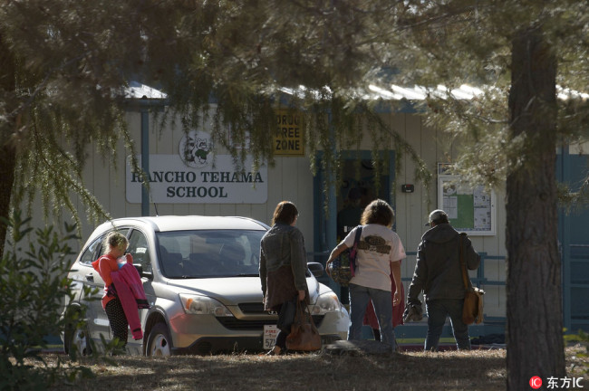 School officials on Rancho Tehama Elementary School campus in Rancho Tehama Reserve in Corning, CA on Tuesday, November 14, 2017. According to a Tehama County Sheriff spokesman, a gunman shot and killed four presumably random victims, and wounded ten others in a shooting spree that took place in several separate location including an elementary school. Two children were shot and wounded. The gunman was ultimately shot and killed by law enforcement officers. [Photo: IC]
