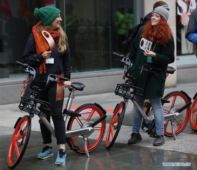 Cyclists try out the new Mobike in Manchester, Britain on June 29, 2017.