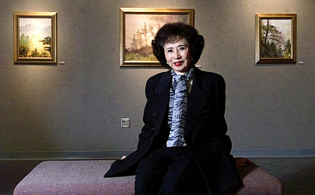 March Fong Eu, former California Secretary of State, is seated among some of her paintings at California State University in Sacramento, California, on November 28, 2000. [File Photo: AP/Rich Pedroncelli]