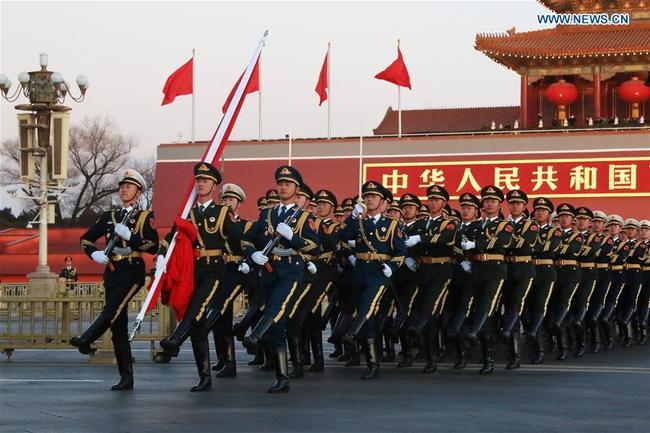 The Guard of Honor of the Chinese People's Liberation Army(PLA) perform the national flag-raising duty at the Tian'anmen Square in Beijing, capital of China, Jan. 1, 2018. The responsibility for guarding China's national flag and firing salute cannons at the Tian'anmen Square was transferred to the Chinese People's Liberation Army from Jan. 1, 2018, as authorized by the Central Committee of the Communist Party of China. Before Jan. 1, the ceremony was conducted by the armed police. [Photo: Xinhua/Shen Hong]