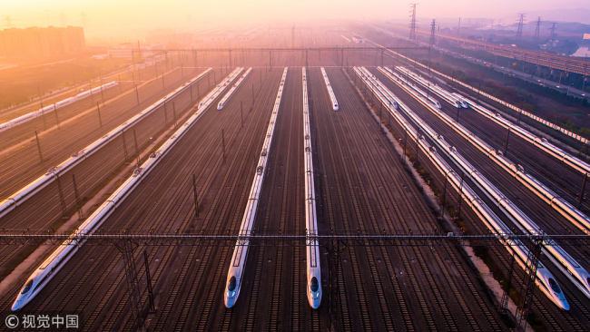Photo shows high-speed trains at a maintenance base in Wuhan, Hubei Province on December 5, 2014. [Photo: VCG]