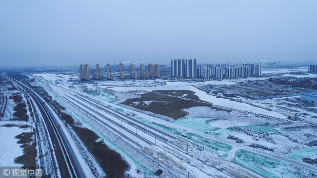 Yinchuang, capital of northwestern China's Ningxia Hui Autonomous Region, receives its first snowfall in 2018 on Wednesday. [photo: www.vcg.com]