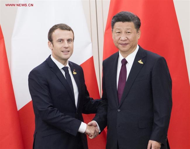 Chinese President Xi Jinping (R) meets with his French counterpart Emmanuel Macron in Hamburg, Germany, July 8, 2017. [Photo: Xinhua]