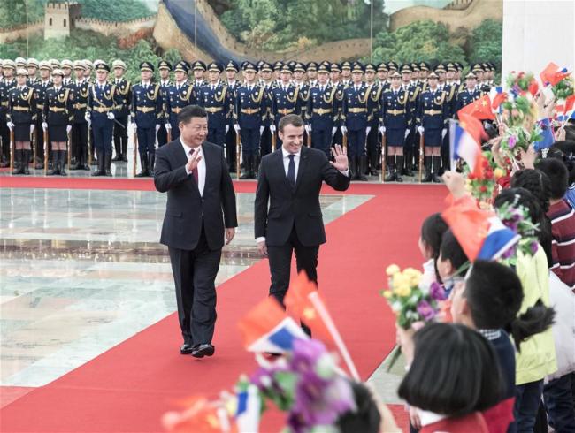 Chinese President Xi Jinping (L) holds a welcome ceremony for visiting French President Emmanuel Macron before their talks in Beijing, capital of China, Jan. 9, 2018.[Photo: Xinhua]