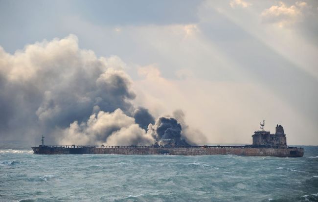 Handout photo from China's Transport Ministry from January 9, 2018 shows smoke and flames coming from the burning oil tanker 'Sanchi' off China's east coast. [Photo: VCG]