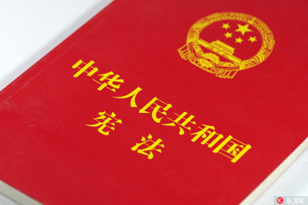 The photo shows a publication of China's Constitution. [Photo: IC]