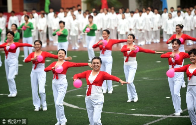 Candidates perform square dances at the opening of a sports meeting in Hefei city, east China's Anhui Province on October 23, 2016. [File Photo: VCG] 