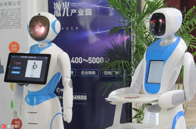 Robots are on display during the 2017 China Optics Valley International AI Industry Summit in Wuhan city, central China's Hubei province, 19 November 2017. [Photo: IC]