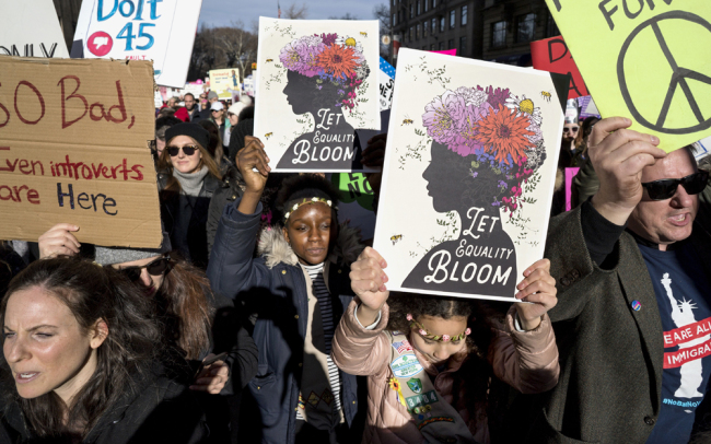 People taking part in a Women's March highlighting equal rights and equality for women walk along Sixth Avenue, Saturday, Jan. 20, 2018, in New York. [Photo: AP/Craig Ruttle]