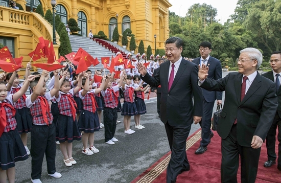 Chinese President Xi Jinping, also general secretary of the Communist Party of China Central Committee, attends a grand welcome ceremony hosted by Nguyen Phu Trong, general secretary of the Communist Party of Vietnam Central Committee, ahead of their talks in Hanoi, Vietnam, Nov. 12, 2017.[File Photo: Xinhua]