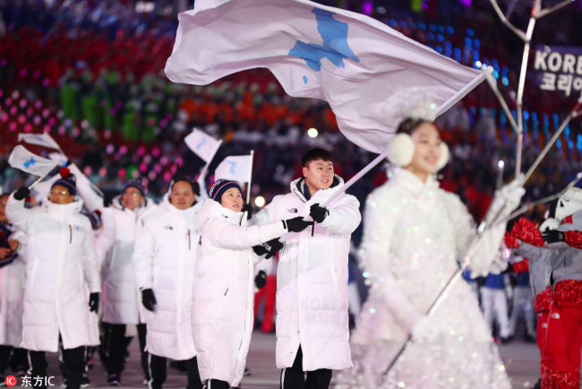 Chung Gum Hwang and Yunjong Won lead the combined delegation of North Korea and South Korea during the opening ceremony for the Pyeongchang 2018 Olympic Winter Games at Pyeongchang Olympic Stadium. [Photo: IC/USA TODAY Sports/Rob Schumacher]