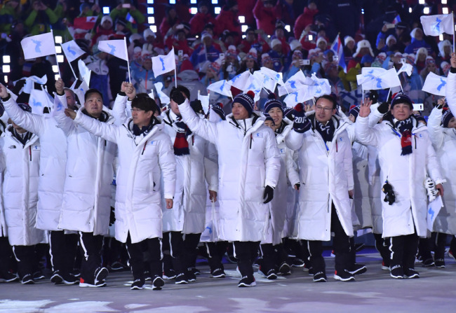 ROK, DPRK athletes march together at opening ceremony of Winter Olympics in Pyeongchangon February 9, 2018. [Photo: Xinhua]