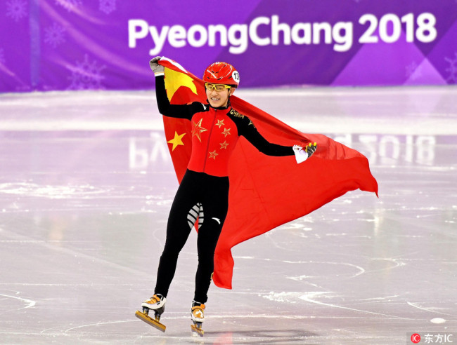 China’s Li Jinyu celebrates after winning a silver medal in women’s 1500m short track speed skating at the PyeongChang Winter Olympic Games on Saturday. [Photo: IC]