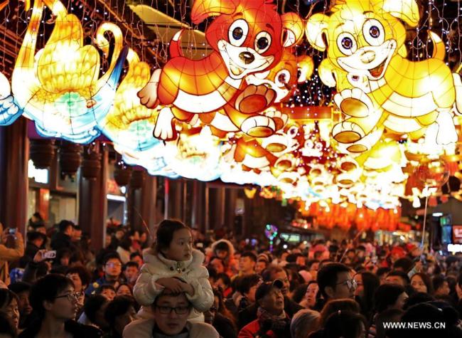 Tourists enjoy lanterns and decorations for the Chinese Lunar New Year at Yuyuan Garden in east China's Shanghai, Feb. 17, 2018. Various celebrations were held all over China, to embrace the Spring Festival, or the Chinese Lunar New Year, which fell on Feb. 16 this year. [Photo: Xinhua/Zhuang Yi]