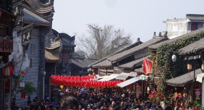 Tourists visit the famed Luodai Ancient Town, an eastern suburb of Chengdu, capital city of Sichuan Province, February, 20, 2018. [Photo: China Plus/Yang Yong]