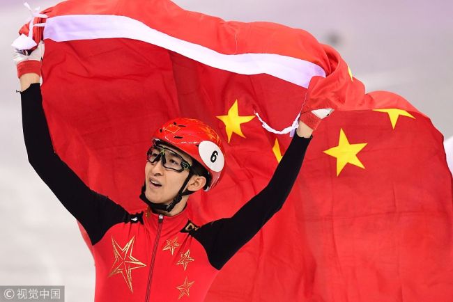 China's Wu Dajing celebrates winning gold and a new world record in the men's 500m short track speed skating A final event during the Pyeongchang 2018 Winter Olympic Games, at the Gangneung Ice Arena in Gangneung on February 22, 2018. [Photo: VCG]