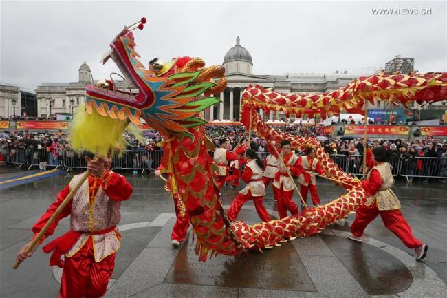 People watch dragon dance to celebrate the Chinese Lunar New Year at Trafalgar Square in London, Britain, on Jan. 29, 2017. [Photo: Xinhua]
