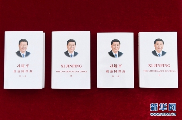 The Chinese and English editions of the second volume of "Xi Jinping: The Governance of China". [Photo: Xinhua]