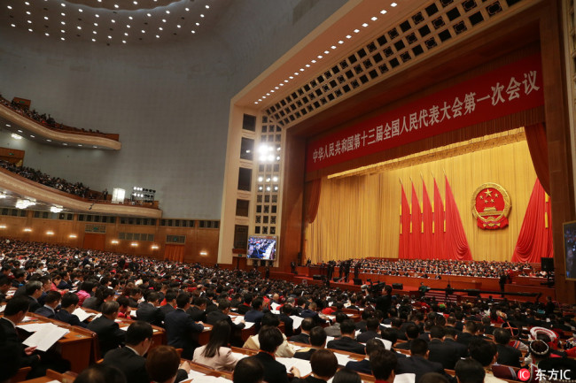 Deputies attend the opening meeting for the First Session of the 13th National People's Congress (NPC) at the Great Hall of the People in Beijing, China, 5 March 2018. [Photo: IC]