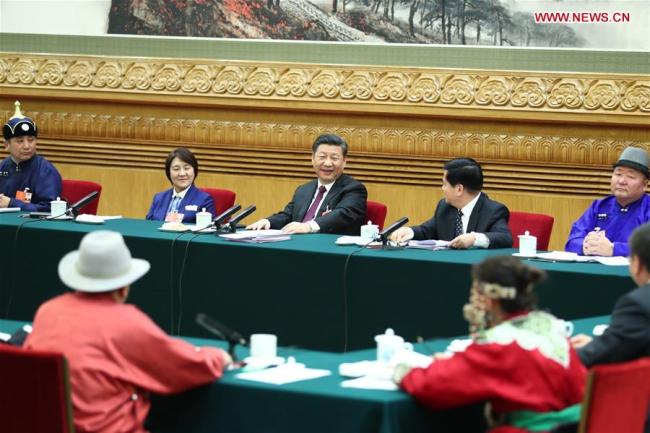 Chinese President Xi Jinping, also general secretary of the Communist Party of China (CPC) Central Committee and chairman of the Central Military Commission, joins a panel discussion with the deputies from Inner Mongolia Autonomous Region at the first session of the 13th National People's Congress in Beijing, capital of China, March 5, 2018. [Photo: Xinhua/Xie Huanchi]