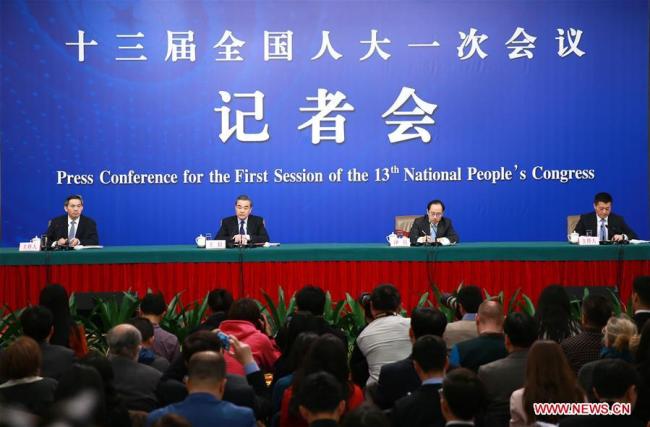 Chinese Foreign Minister Wang Yi (C) answers questions on China's foreign policies and foreign relations at a press conference on the sidelines of the first session of the 13th National People's Congress in Beijing, capital of China, March 8, 2018. [Photo: Xinhua]