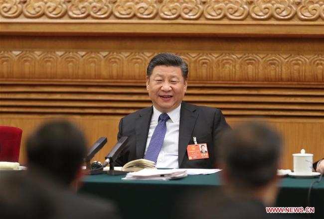 Chinese President Xi Jinping, also general secretary of the Communist Party of China (CPC) Central Committee and chairman of the Central Military Commission, joins a panel discussion with the deputies from Guangdong Province at the first session of the 13th National People's Congress in Beijing, capital of China, March 7, 2018. [Photo: Xinhua/Sheng Jiapeng]