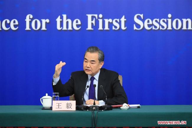 Chinese Foreign Minister Wang Yi answers questions on China's foreign policies and foreign relations at a press conference on the sidelines of the first session of the 13th National People's Congress in Beijing, capital of China, March 8, 2018. [Photo: Xinhua]