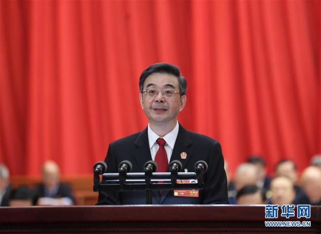 Zhou Qiang, Chief of the Supreme People's Court, delivers a report a plenary meeting of the on-going first session of the 13th National People's Congress. [Photo: Xinhua]