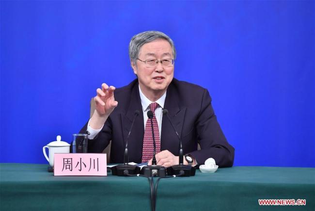 Zhou Xiaochuan, governor of the People's Bank of China (PBOC), answers questions at a press conference on financial reform and development on the sidelines of the first session of the 13th National People's Congress in Beijing, capital of China, March 9, 2018. [Photo: Xinhua]