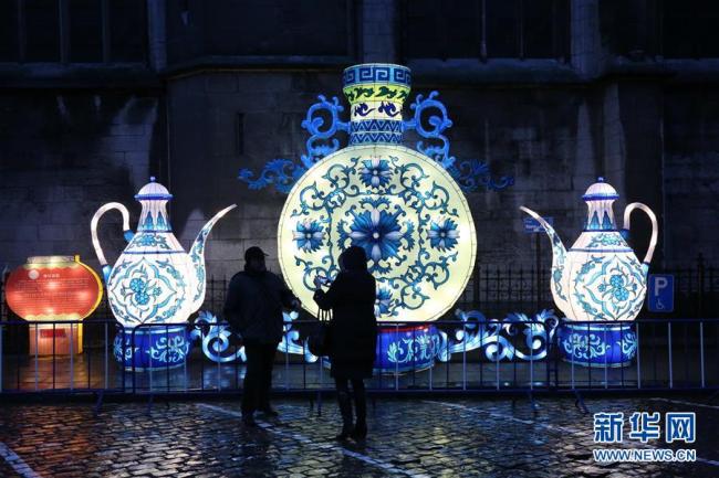 Visitors view an exhibition of giant luminous Chinese lanterns in Dinant, Belgium, on Friday, March 9, 2018. [Photo: Xinhua]