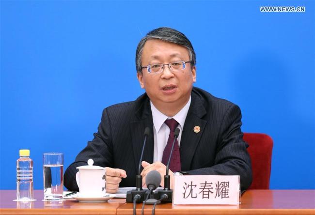 Shen Chunyao, secretary of the Bill Group of Secretariat of the first session of the 13th National People's Congress (NPC) and chairman of the Legislative Affairs Commission of the NPC Standing Committee, answers questions at a press conference on an amendment to the country's Constitution in Beijing, capital of China, March 11, 2018. [Photo: Xinhua/Jin Liwang]