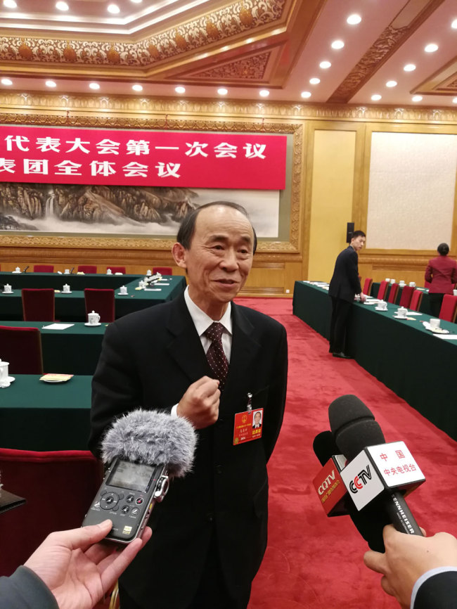 Ma Shanxi, a deputy from the municipality of Chongqing for the 13th National People's Congress (NPC) is interviewed by journalists on March 10, 2018. [Photo: China Plus]