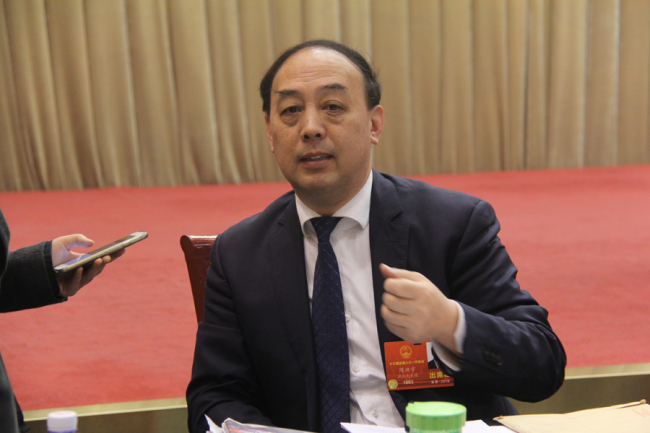 Deputy Zhou Hongyu attends the NPC session of Hubei delegation in Beijing on Mar 9, 2018. [Photo: China Plus/Yang Guang]