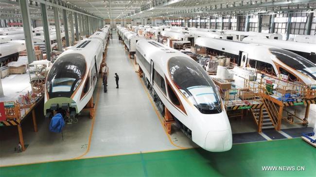 File photo taken on Sept. 14, 2017 shows Fuxing bullet trains at the assembly workshop at CRRC Changchun Railway Vehicles Co. Ltd. in Changchun, northeast China's Jilin Province.[Photo: Xinhua]